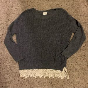 Oversized gray sweater with lace hem